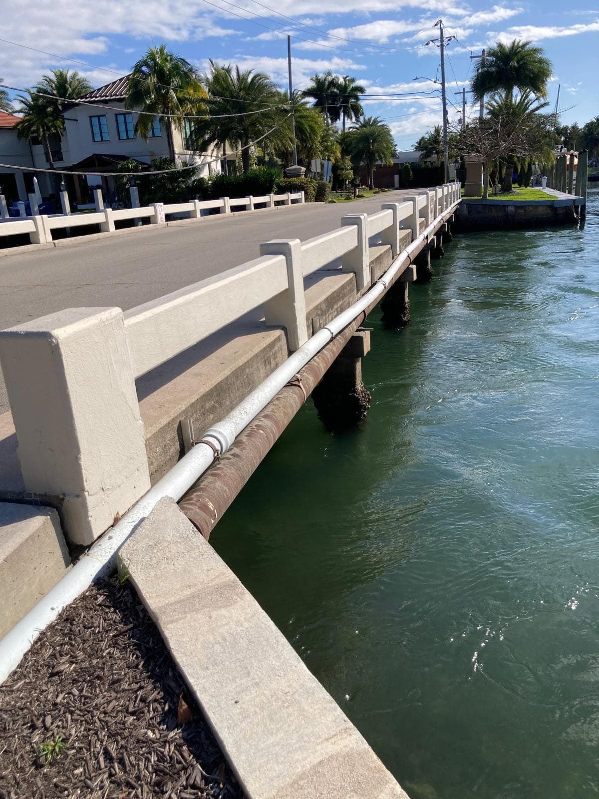 One of the existing low West Lake Drive bridges over a Harbor Beach waterway